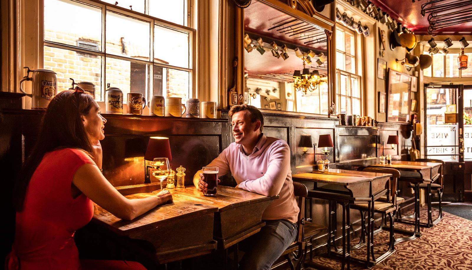 Couple enjoying a drink at The Wykeham Arms Winchester